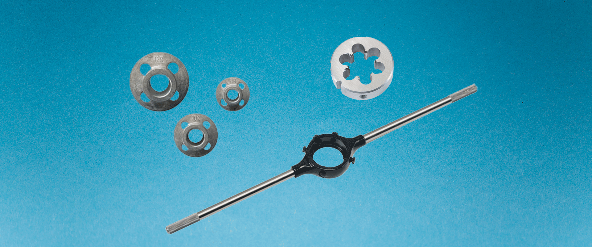Die stock guides, round die, and die holder Image of three die guides, one round die and one die stock