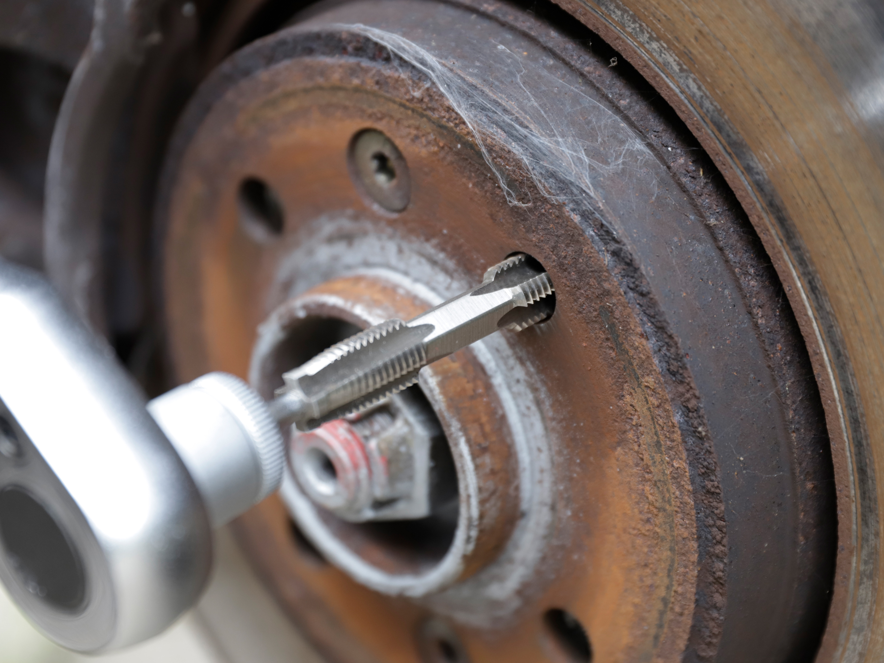 HexTap thread repair heel stud thread repair using double-sided HexTap threading tool operated with correct driver.
