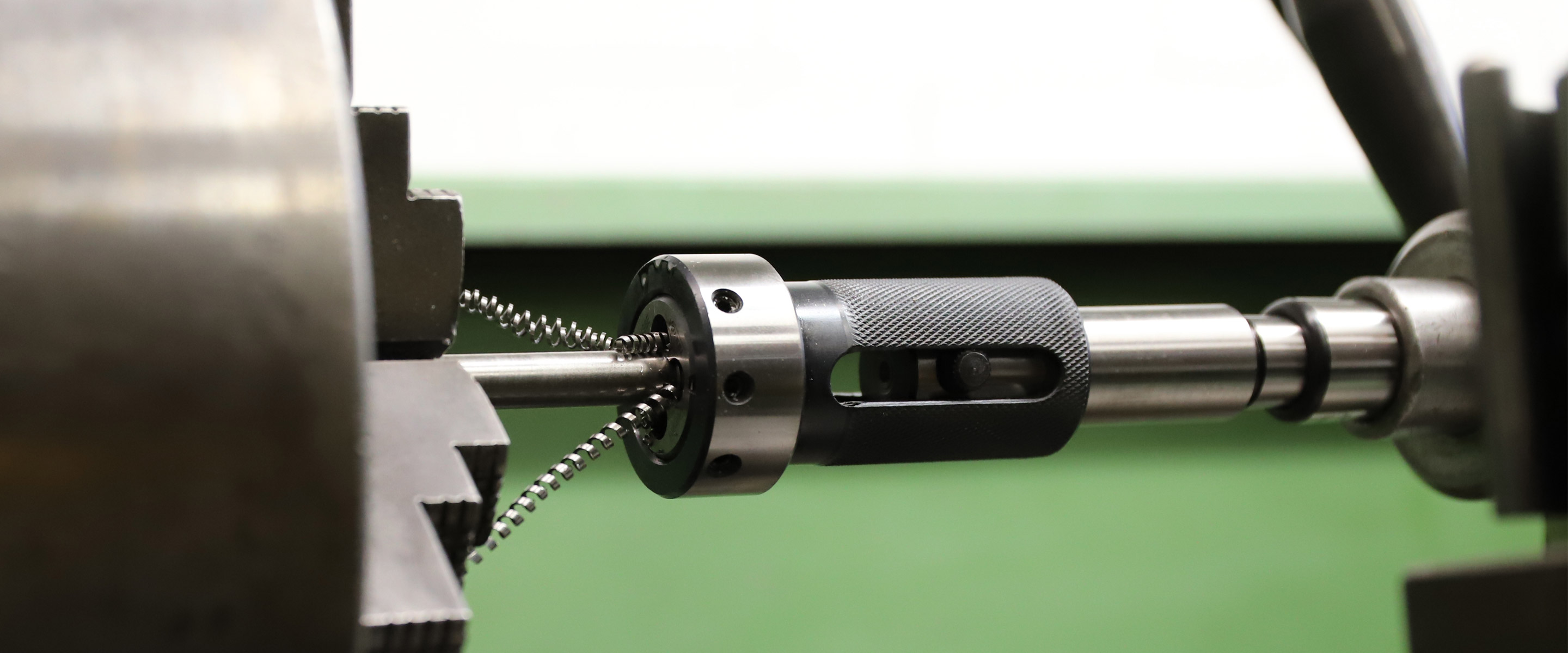 External threading operation on a lathe with metal shavings.