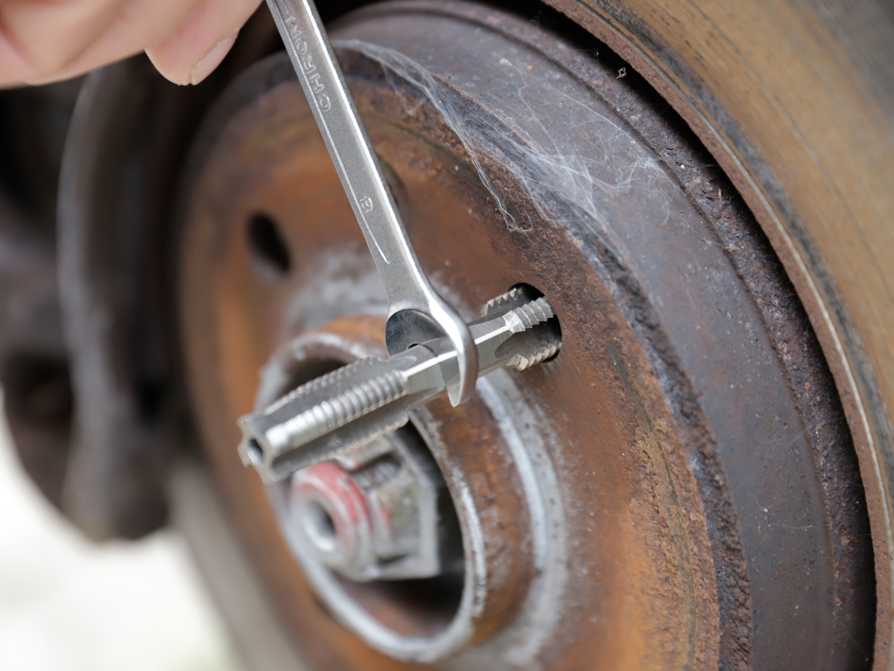 Thread repair with HexTap Open-end wrench driving HexTap tool to restore bolt thread.